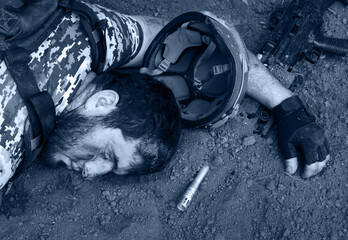 Wounded soldier laying on the ground