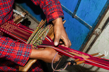 The weaving hands of a woman from the village of Tupe, laborious craftsmanship, with great patience and creativity, bring the fabrics to life. Tupe, Yauyos, Perú.