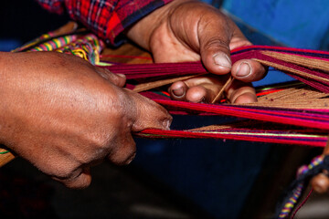 The weaving hands of a woman from the village of Tupe, laborious craftsmanship, with great patience and creativity, bring the fabrics to life. Tupe, Yauyos, Perú.