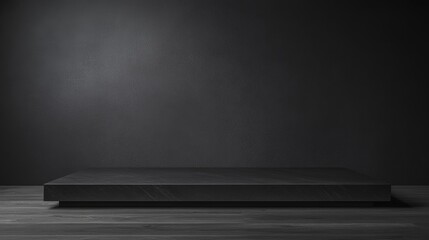 Simple Black Platform Positioned Against Deep Shadowy Backdrop for Presentation