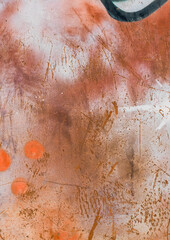 old graffiti wall with faded paint, deep scratches, and visible signs of wear and tear. The surface shows layers of spray paint, peeling texture, and rough markings, creating a gritty urban background