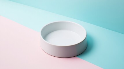 Empty White Ceramic Pet Food Bowl Placed on Soft Pastel Pink and Blue Gradient Background