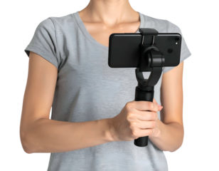 A person holding a black phone gimbal with a phone attached