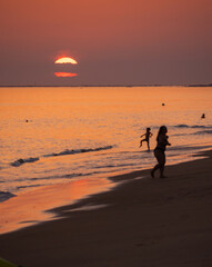 Obraz premium Mazagón, Huelva, Spain - August 12, 2025. Golden Sunset at Mazagón Beach