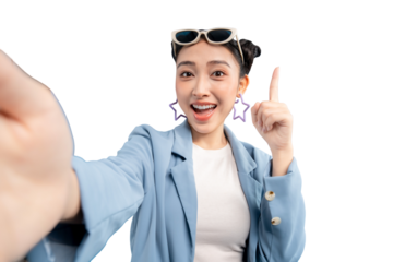 Portrait young Asian woman joyfully taking selfie photo while wearing sunglasses, in her hands. She points her index finger up with exciting gesture on PNG