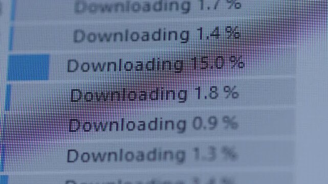 Close-up of computer screen showing multiple files downloading with blue progress bars indicating completion percentage, illustrating data transfer, ftp and internet technology concepts, slow motion.