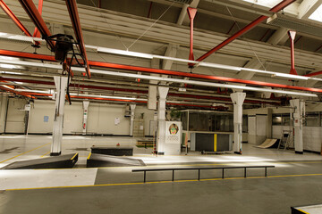 Spacious industrial building interior, repurposed as a skate park.  Perfect for urban, industrial, and alternative themes.