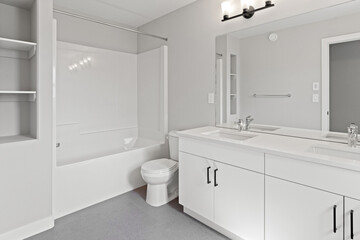 Bathroom with a white toilet and a white bathtub