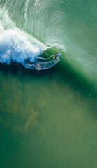 Aerial view of pro surfers on ocean waves