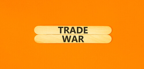 Trade war symbol. Concept word Trade war on beautiful wooden sticks. Beautiful orange paper...