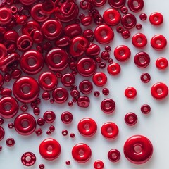 **Crimson Rings of Glass**: A scattering of bright, **glossy red donut-shaped beads** in assorted sizes creates a vibrant pattern that fades across a white surface, perfect for **jewelry making** and 