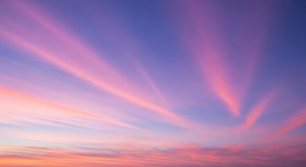Vibrant pink and purple sunset sky with wispy clouds