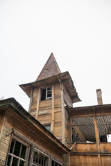 Abandoned wooden tower with broken spire creates eerie gothic mood