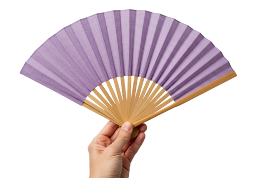 Hand holding a purple folding fan isolated, traditional Asian accessory for cooling off