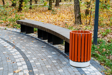 The modern bench and trash can design together create a welcoming atmosphere in the park, enhancing community enjoyment while promoting sustainability and environmental care for all
