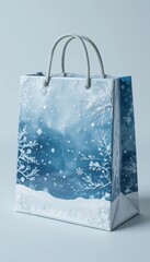 Blue gift bag with detailed winter snowflake and snow covered tree branches design