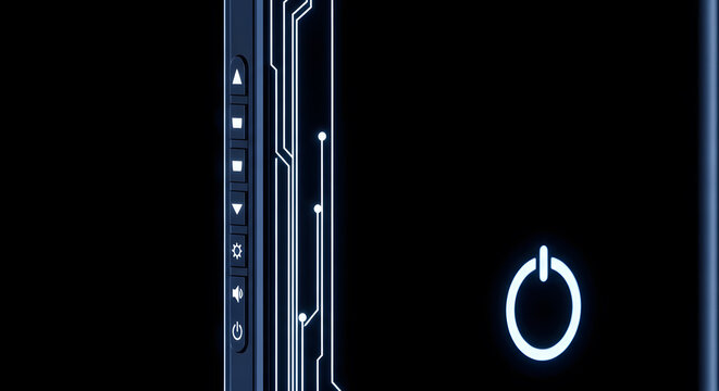 Close up of a glowing power button and circuit board on a dark background