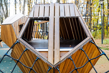 This wooden play structure is aesthetically pleasing and enhances outdoor playgrounds, promoting climbing, education, exercise, and exploration to engage childrens desire for fun and active play