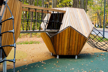 Discover an Innovative Wooden Playground Structure with Climbing Features that promote activity and adventure for children. This colorful design fosters creativity, exploration, and fitness safely