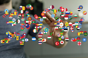 Abstract image representing global network connection with multiple country flags floating around a...