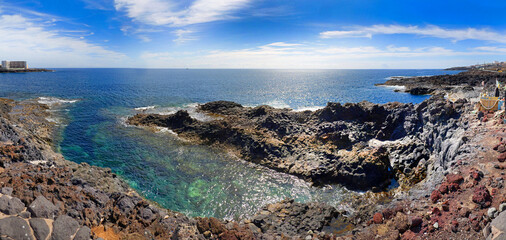 Beach of La Garita, Gran Canaria. Volcanic coastal landscape with lava rock, popular spot for nature lovers and walkers.