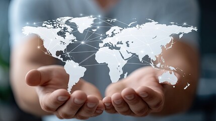Hands hold a digital representation of the world with connected nodes symbolizing global network and communication at a modern workspace