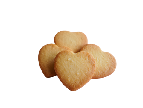 Group of golden heart-shaped shortbread cookies lightly dusted with sugar, isolated on a transparent background