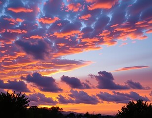 Obraz premium Serene twilight sky with soft, fluffy clouds painted in hues of orange, pink, and purple, fluffy, peaceful, horizon