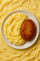 mashed potatoes with meat patties
