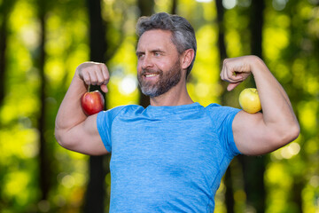 Sport outdoors concept. Fit and healthy sport man workout in park. Biceps concept. Fit man on green concept. Healthy sport in nature workout for wellness. Health and power concept.