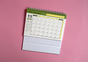 Desktop calendar for November 2025 on a pink background, with a dedicated space for copying.
