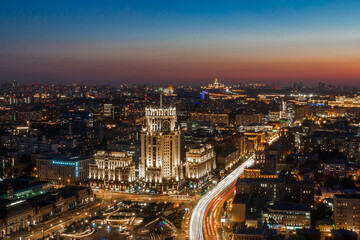 Obraz premium City skyline at dusk with bright lights, bustling streets, and stunning architecture in a vibrant urban landscape