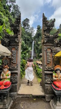 Woman at Gitgit waterfall in Bali , Singaraja, Indonesia