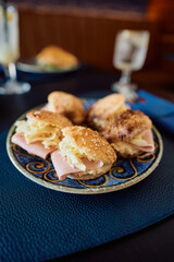 Finger sandwiches on plate.
