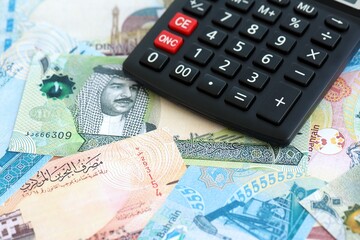 Bahraini dinar currency money bills and calculator. The concept of taxation and money count