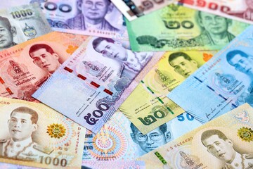 Thai baht currency money bills. The current banknotes lies on table in big amount