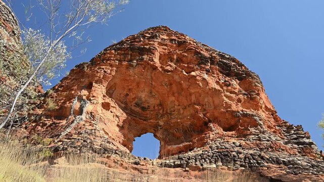 rock arch at Purnululu National Park, World Heritage Site in the kimberley region of Western Australia, a popular travel destination famous for its layered rock formations, of the Bungle Bungle Range.