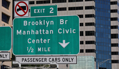 Big Green Road sign with directions to Brooklyn Bridge or Manhattan Civic Center