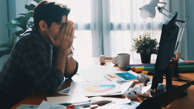 Top down view of designer working on palettes and crumpled paper. Top view of skilled business man run out of idea while sleeping at meeting table. Project manager crumpled and throw paper. Symposium.