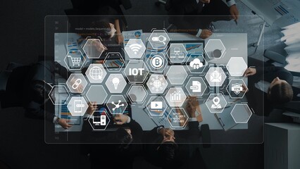 A diverse business team collaborates in a modern office, surrounded by IoT icons and data charts, focusing on technology strategies and innovative solutions for growth. Raster