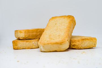 Close-up still life of golden brown Rusk biscuits, a popular Indian snack, neatly arranged on a...