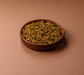 Dried chamomile flowers, herbal tea in a bowl for a hot morning drink. Dried chamomile