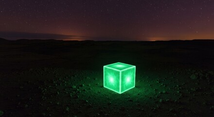 Glowing green cube on a dark desert landscape under starry sky