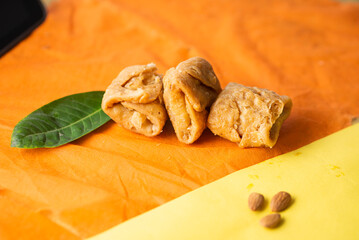 Khaja, a famous sweet from Bihar, is made of layered refined flour dough deep-fried and soaked in sugar syrup. Crispy outside and soft inside, it’s a festive delicacy served at weddings and rituals.