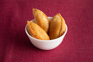 Gujhia, also called Pedakiya or Purukiya in Bihar, is a festive sweet made of flour pockets stuffed with khoya, coconut, and dry fruits. Deep-fried to golden perfection, it’s a Holi and Diwali favorit