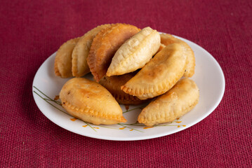 Gujhia, also called Pedakiya or Purukiya in Bihar, is a festive sweet made of flour pockets stuffed with khoya, coconut, and dry fruits. Deep-fried to golden perfection, it’s a Holi and Diwali favorit