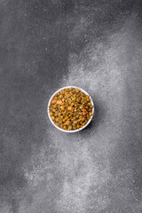 Dried chamomile flowers, herbal tea in a bowl for a hot morning drink. Dried chamomile