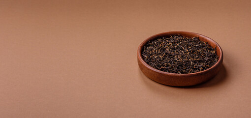 Golden black tea, dried leaves of a Chinese or Indian breakfast drink. Black tea dried leaves