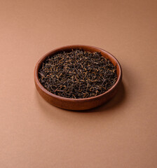 Golden black tea, dried leaves of a Chinese or Indian breakfast drink. Black tea dried leaves