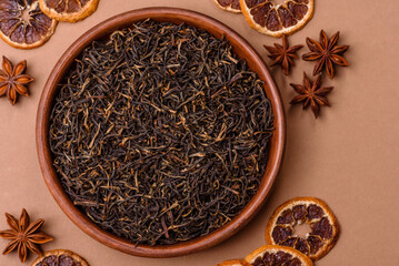 Fototapeta premium Golden black tea, dried leaves of a Chinese or Indian breakfast drink. Black tea dried leaves